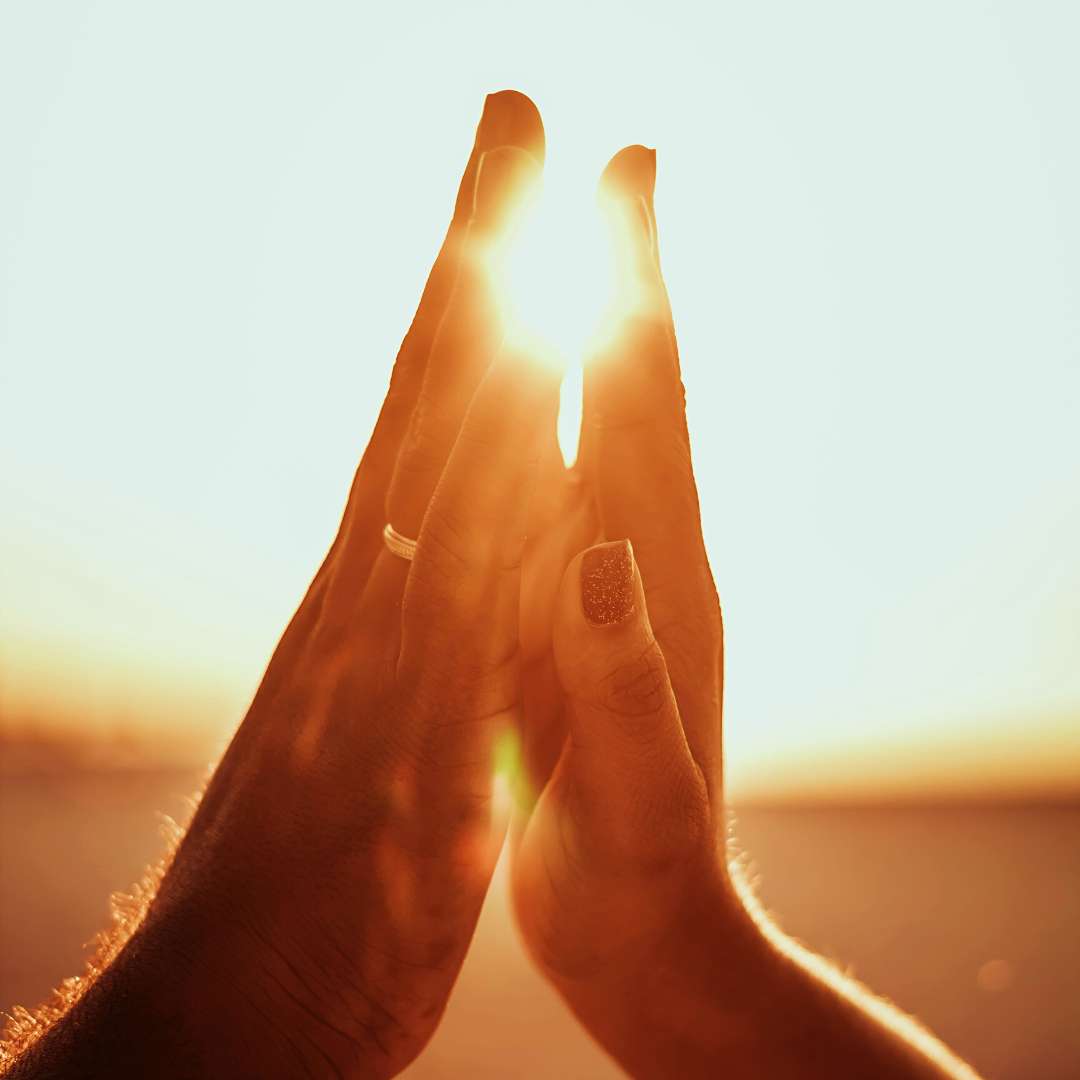 Two hands reaching out to each other, symbolizing openness and connection in human relationships.